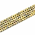 Macro detail of 8mm frosted natural stone round beads with mixed gray and yellow textures - 8mm / Light Yellow