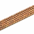 Macro detail of 8mm matte natural stone beads in earthy reddish brown for DIY jewelry making - 8mm / Electroplated Burgundy