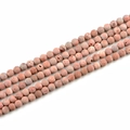 Macro detail of 8mm matte pink porous natural stone beads arranged in parallel rows - 8mm / Orange Red