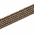 Close-up of 8mm dark brown natural stone beads with matte texture and druzy details - 8mm / Electroplated Coffee