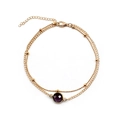 Minimalist gold dual-layer anklet featuring a round purple gemstone and bead chain design - Gold Purple Rhinestone