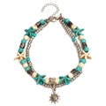 Boho-Fußkettchen mit Türkisperlen, Seestern-Anhängern und Sonnenanhänger auf weißem Grund - Sonnenblumen-Anhänger