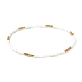 Close-up of handmade white beaded necklace with gold metal accents on plain background - White Gold Minimalist Dotted Bead (8)