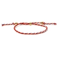 Detail of colorful woven cord bracelet with three gold beads and adjustable slider knot - Red Blue White Mix (Style 3)