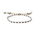 Handmade black and white woven bracelet featuring three polished golden metal beads - Black White Mix (Style 11)