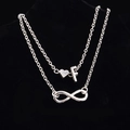 Cavigliera doppia argentata con simbolo dell'infinito e ciondolo a cuore con lettera F - Stile Lettera F
