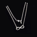 Collana a doppio strato argento con cuore infinito e chiusura OT su fondo nero - Stile Lettera I