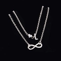 Collana a doppio strato argento con ciondoli a cuore, lettera L e infinito - Stile Lettera L
