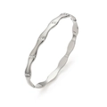 Macro shot of silver wavy bangle with small rhinestones and polished metal finish - Steel