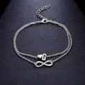 Cavigliera argento con infinito e ciondoli a cuore e lettera G su catena a doppio strato - Stile Lettera G