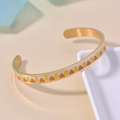 Golden open bangle with colorful enamel leaf patterns in red and yellow on light blue - Gold + Maple Leaf (B037)