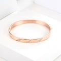 Polished rose gold stainless steel bangle featuring three rows of slanted cubic zirconia - B030-Rose Gold