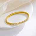 Elegant gold-plated bangle with a half-row of rectangular zircons on a white tray - B139-Gold (White Rhinestone)