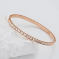 Rose gold stainless steel bangle featuring baguette-cut cubic zirconia in channel setting - Half Pave Zirconia Style / Rose Gold + White Rhinestone (B139)