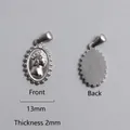 Macro view of silver Roman coin pendant showing front and back relief with 13mm width - Queen Relief Oval Pendant (P00005S)