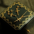 Detail view of 14k gold crucifix necklace and earrings set with Jesus relief on jewelry box - Cross A Style / 3-Piece Set (Without Chain)
