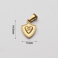 Detailed macro view of a gold shield pendant featuring an engraved heart with the number 13 - Shield Heart Style (BAD101)