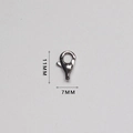 Macro detail of a 11mm by 7mm polished stainless steel lobster clasp for jewelry making - Small Rounded Style (AL11C)