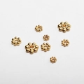 Detailed view of gold snowflake flower spacers in various sizes for DIY jewelry - 3mm / Gold