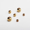 Macro shot of gold-plated stainless steel beads with diagonal textures for jewelry making - 2.5*1 Diagonal Bead / Gold