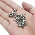 Macro shot of stainless steel spacer beads with grid texture and polished finish in palm - 3mm Outer Diameter (1.5mm Hole) / Original Stainless Steel