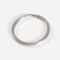Detailed close-up of a silver flat split key ring showing durable stainless steel texture - 1.5mm Wire * 15mm OD / Original Stainless Steel
