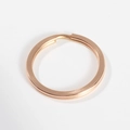 Macro detail of flat rose gold 304 stainless steel key ring with polished finish - 1.5mm Wire * 15mm OD / Rose Gold