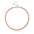Dettaglio della cavigliera con perline rosa salmone da 3mm e chiusura a moschettone in argento - Arancione