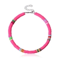 Close-up of pink handmade polymer clay bead anklet with colorful accents and lobster clasp - Red