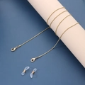 Detail of 1.2mm gold snake chain with lobster clasps and silicone eyewear connectors - Gold