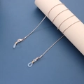 Detail of rose gold snake chain eyewear strap with white silicone non-slip rubber ends - Rose Gold