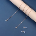 Detail of rose gold beaded chain with lobster clasps and silicone loops for glasses - Rose Gold