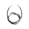 Close-up of black and white beaded chain with gold accents and lobster clasps - Black White With Gold