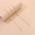 Detail of gold metal glasses chain with white pearls and anti-slip silicone loops - Gold