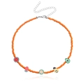 Handmade orange beaded necklace featuring colorful fruit pendants like lemon and watermelon - Orange