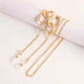 Detail of gold glasses chain featuring hammered oval links and silicone loops - Hammered Texture Large Oval Link Splicing Style (5#)