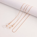 Detailed close-up of golden snake chain with lobster clasps and silicone loops for glasses - 1# Gold
