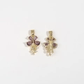 Detail view of gold flower pendants with purple gemstones and shimmering tassels - Purple