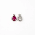 Close-up of red teardrop pendants with silver frame and textured back for DIY jewelry - Rose Red