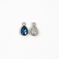 Macro detail of teardrop blue crystal pendant with silver textured back for DIY jewelry - Navy Blue