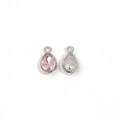Detailed front and back views of pink teardrop crystal charms with silver hammer texture - Pink