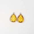 Detail of yellow faceted teardrop pendant with gold metal frame for DIY jewelry making - Yellow