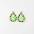 Macro shot of light green teardrop crystal charms with rose gold bezel for DIY jewelry - Light Green