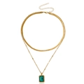 Double-layered gold snake chain necklace with emerald green gemstone pendant and crystal halo - Green Rectangular Pendants / Gold/Green