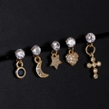 Detailed macro view of five gold zircon stud earrings with celestial and heart pendants - Round Blue Stone Style (1#)