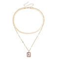 Double-layered golden necklace featuring a flat snake chain and pink gemstone pendant - Gold/Light Pink
