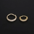 Macro shot of gold-plated copper nose rings with cubic zirconia in two different sizes - Small / Gold