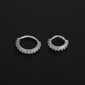 Detail of two silver hinged hoop rings in different sizes with cubic zirconia inlay - Small / Silver