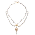 Double-layered pearl necklace with golden bow, hollow heart, and cross pendant design - Bow Heart Cross Style (ZW776 Gold)