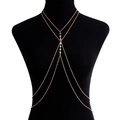 Sexy double-layered golden body chain with sparkling zircon stones on a black torso - Gold